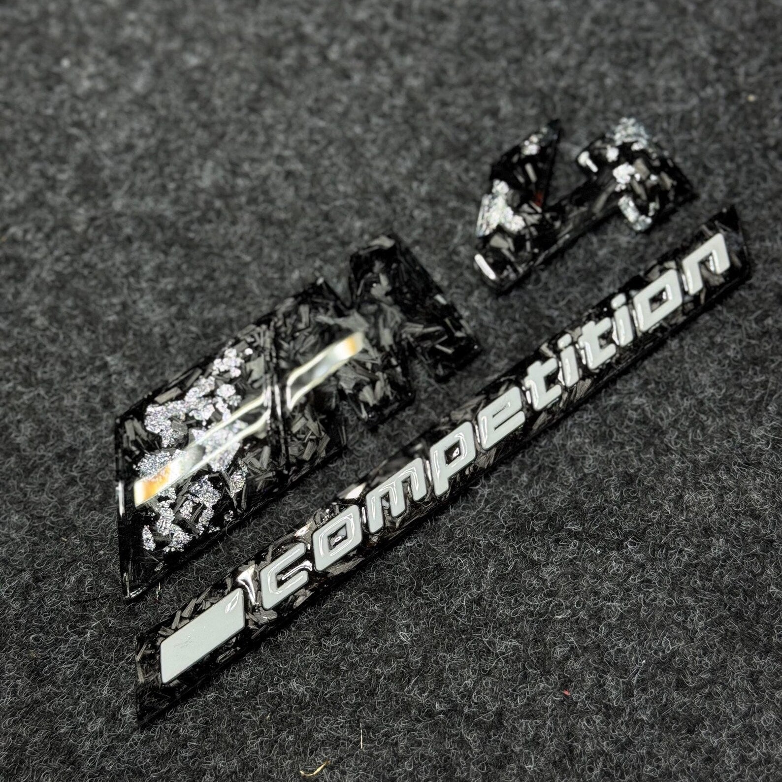 badge m4 competition silver carbon forged